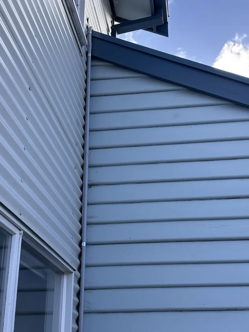 Split system outdoor condenser unit installed on brick wall, Melbourne